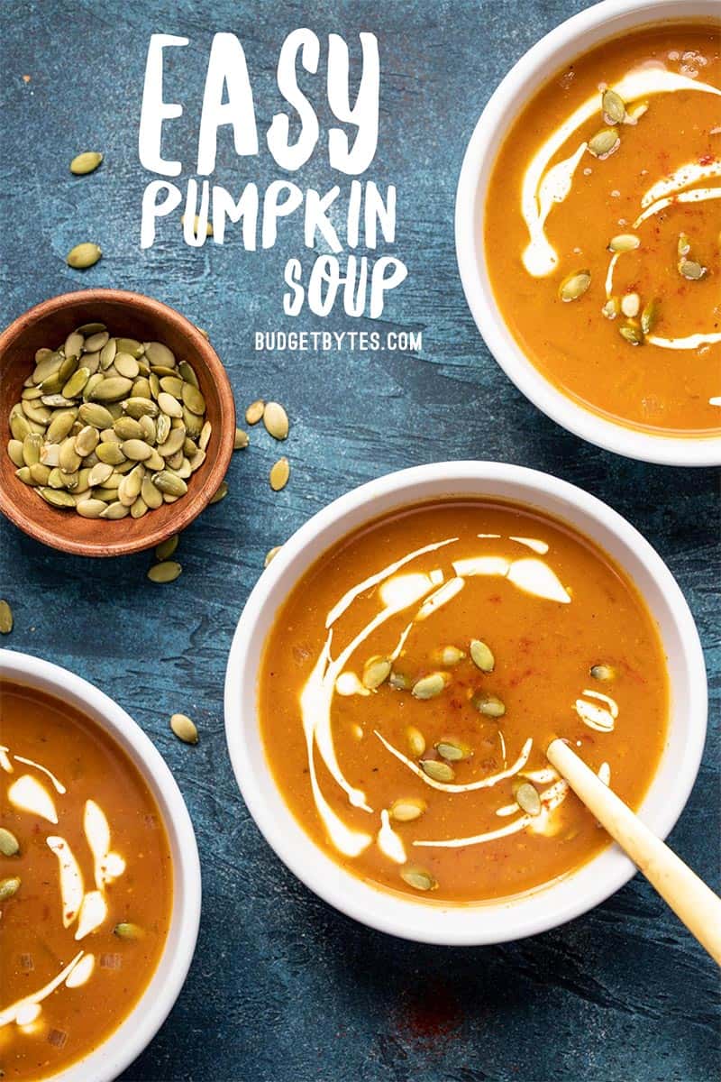 Three bowls of Easy pumpkin Soup garnished with sour cream and pepitas, title text at the top