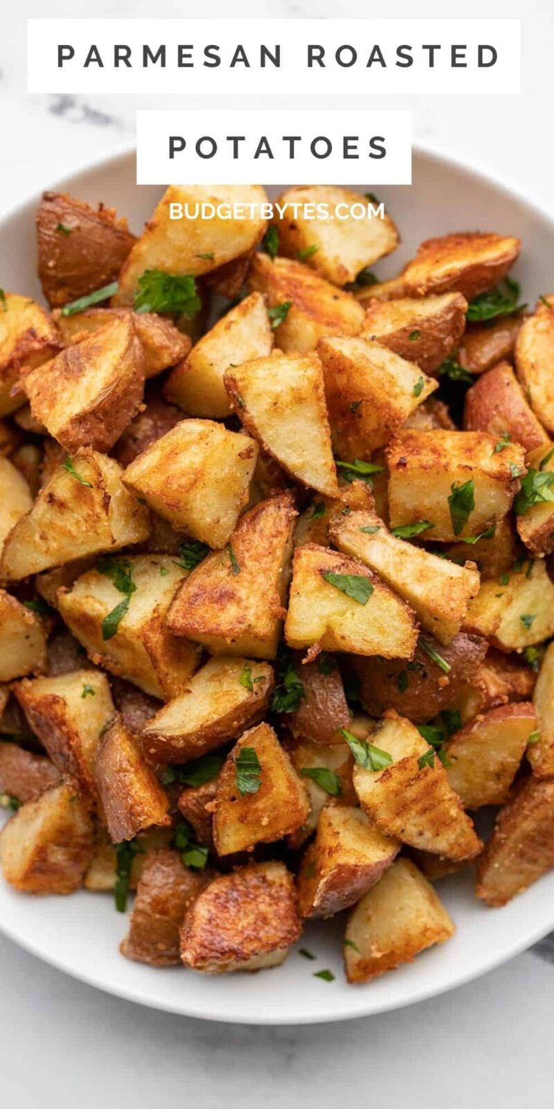Parmesan roasted potatoes in a bowl, title text at the top