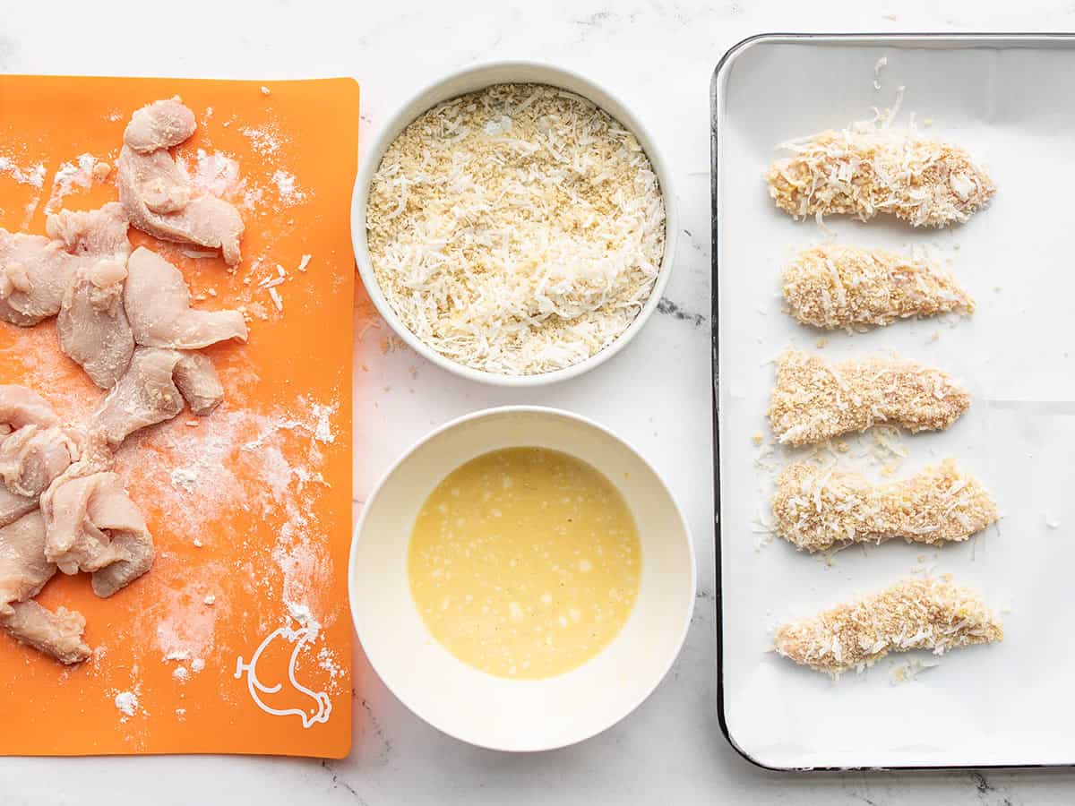Breading station with chicken, egg wash, coconut and breadcrumbs