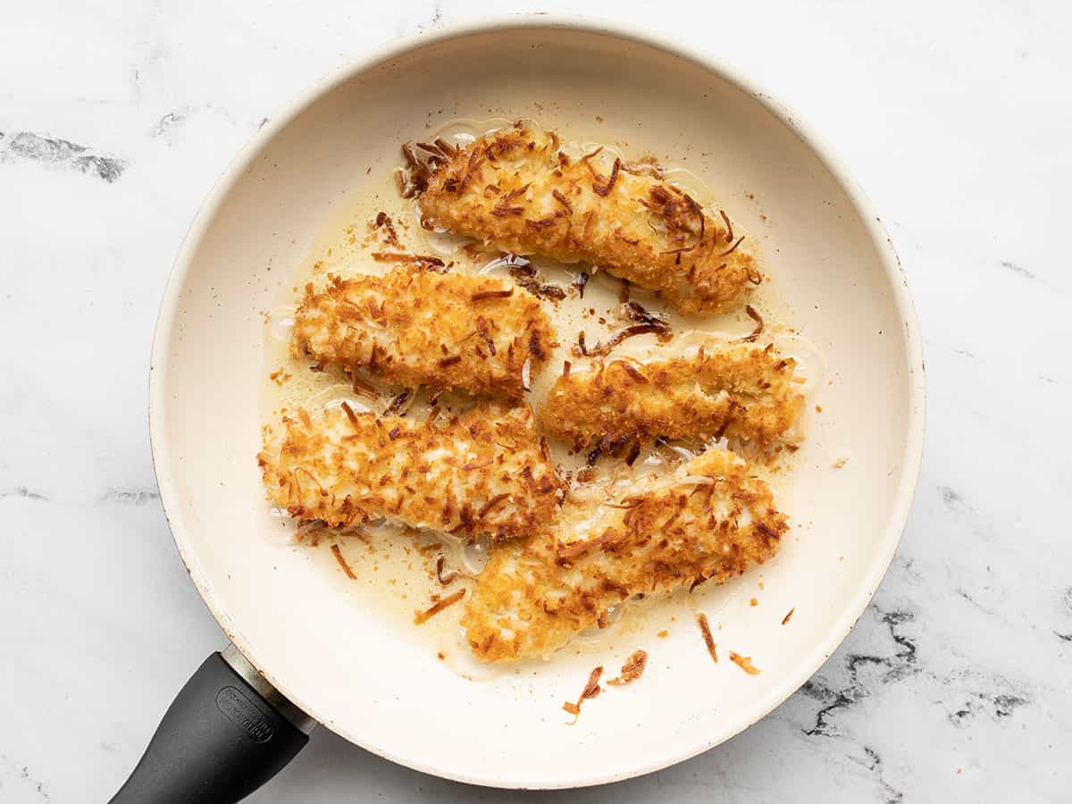 Browned chicken strips in the skillet