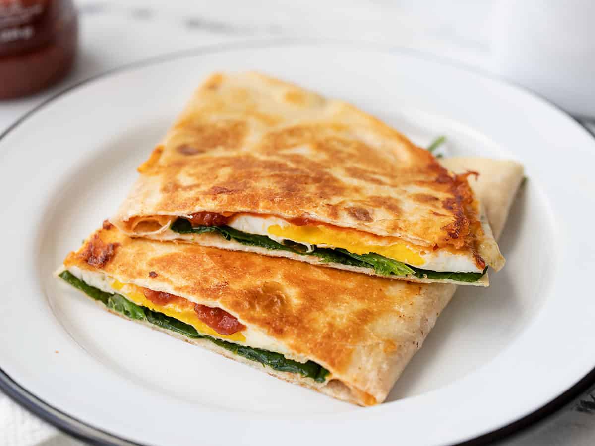 Cut breakfast quesadilla on a plate