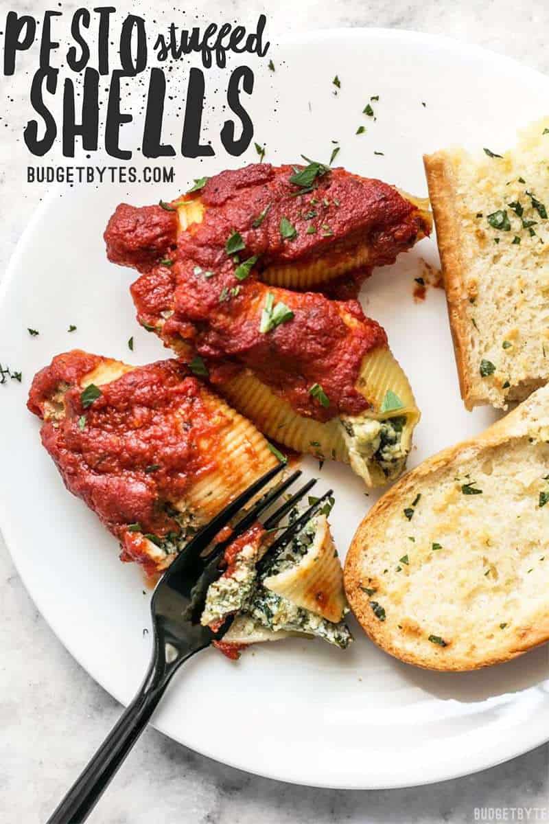 Pesto Stuffed Shells are an easy and impressive dish that is a filling and flavorful alternative to a meat-heavy Italian meal. Freezer friendly! Budgetbytes.com