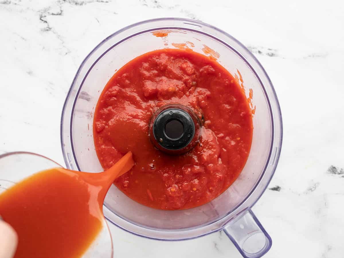 Crushed tomatoes and vegetable juice in food processor