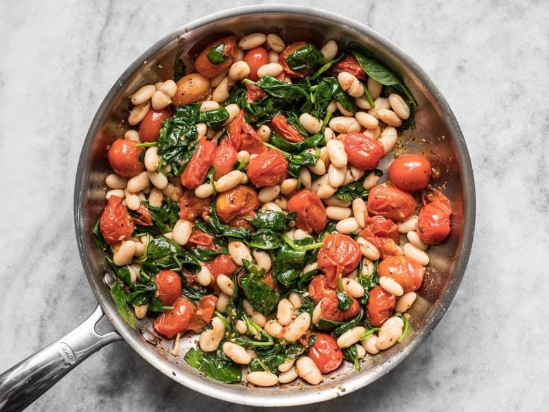 Drained beans added to the skillet