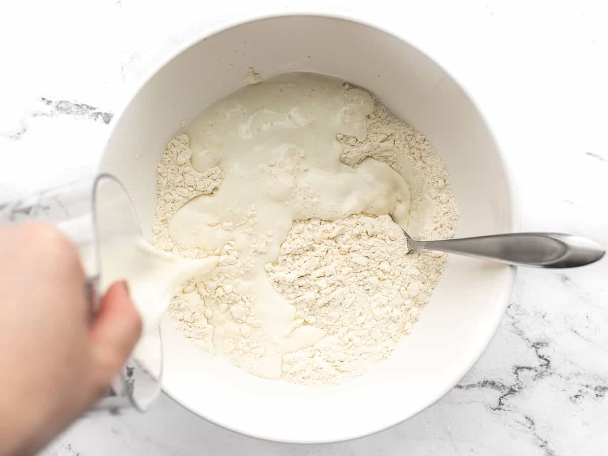Milk being poured into the batter