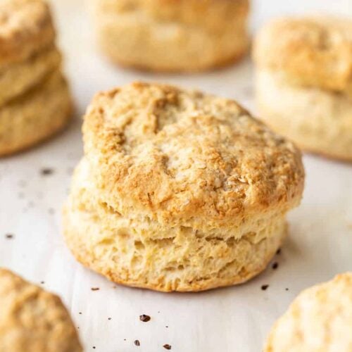 Side view of baked biscuits on a baking sheet