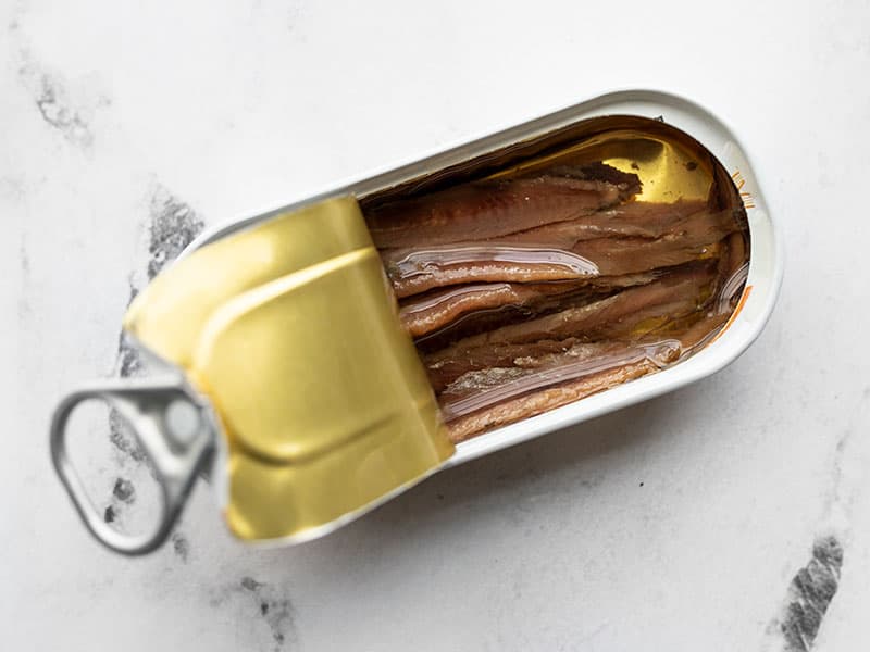 Open tin of anchovies in oil