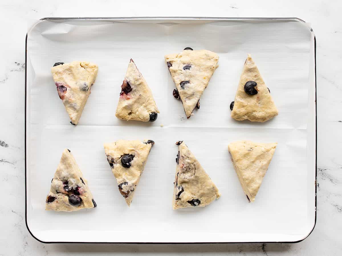 Cut scones on a baking sheet lined with parchment