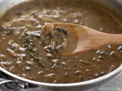 This one quick, easy, and insanely flavorful Mushroom Herb Gravy will satisfy both meat eaters and vegetarians alike. Step by step photos. BudgetBytes.com