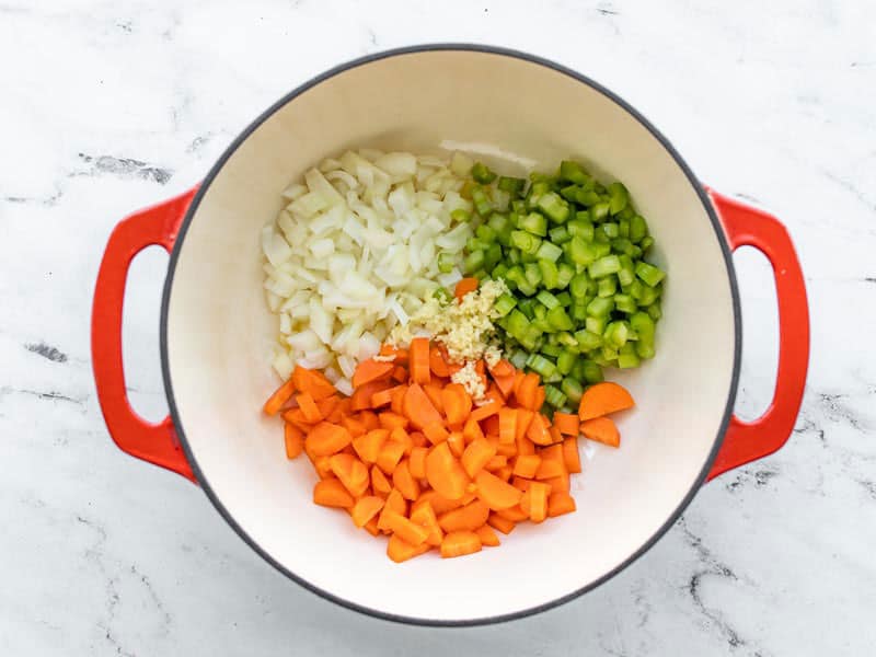 Chopped onion, celery, carrots, and minced garlic in the soup pot