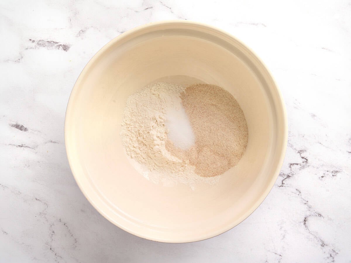 Flour, whole wheat flour and salt in a bowl.