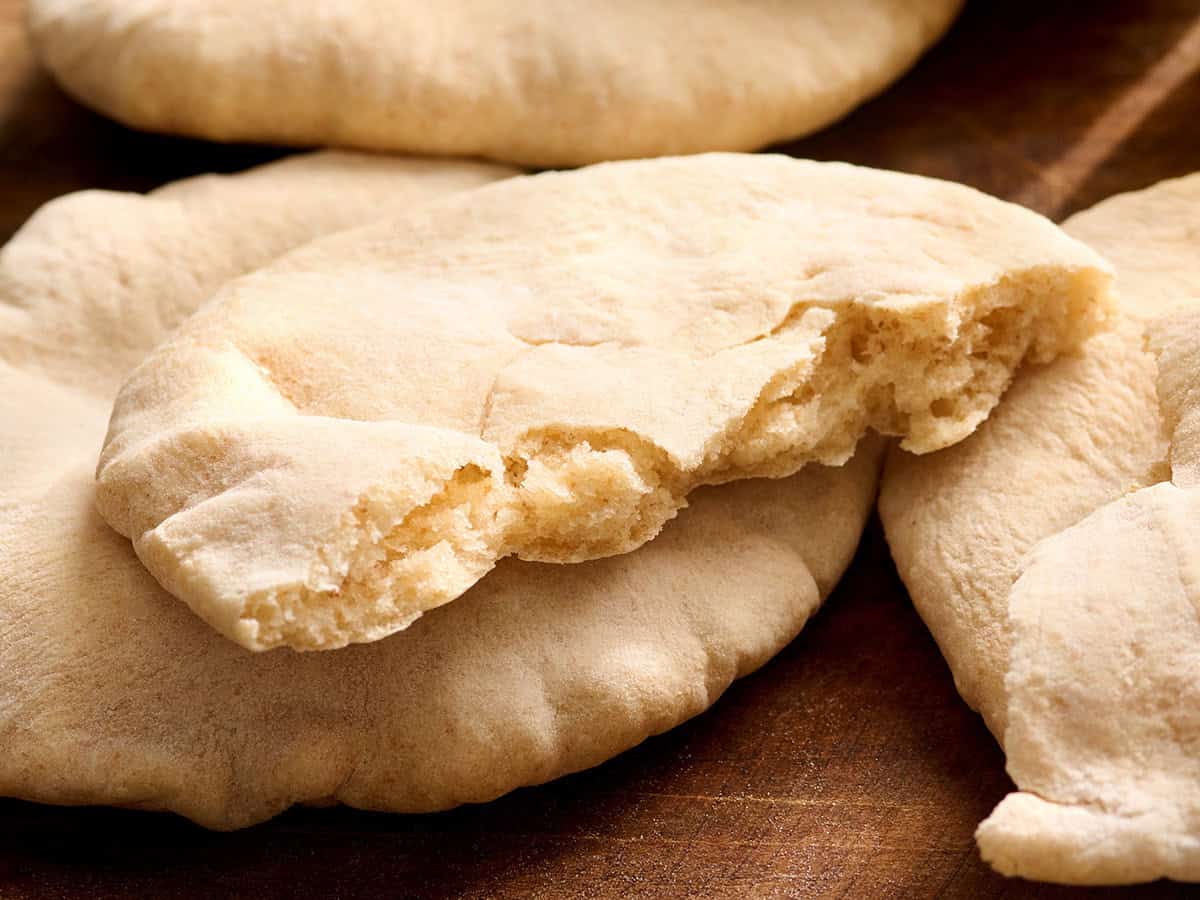 A homemade pita bread split in half.