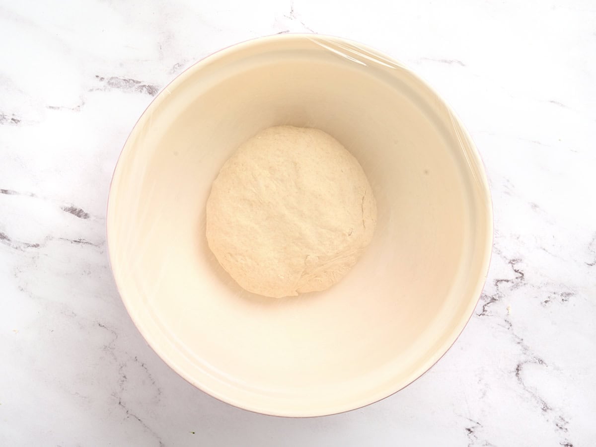 Pita bread dough in a bowl before proofing.