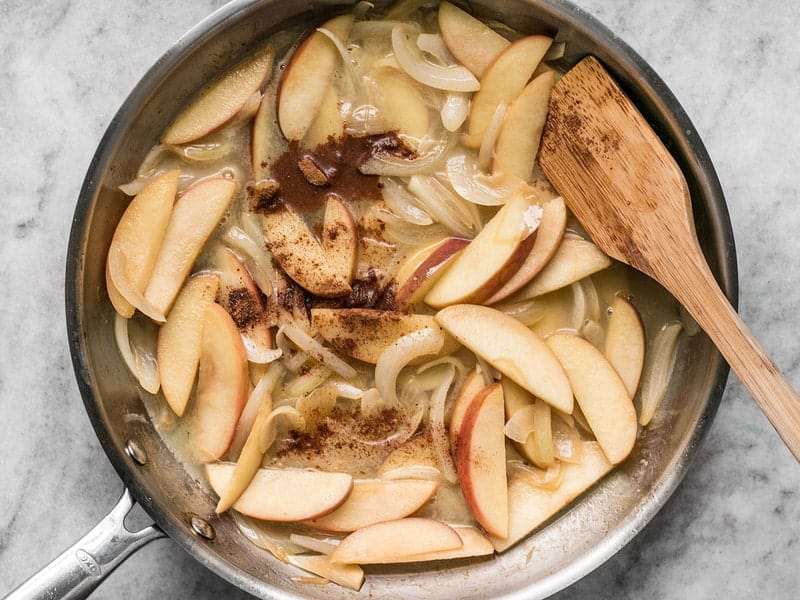 Add Broth and Spices to skillet with apples and onions