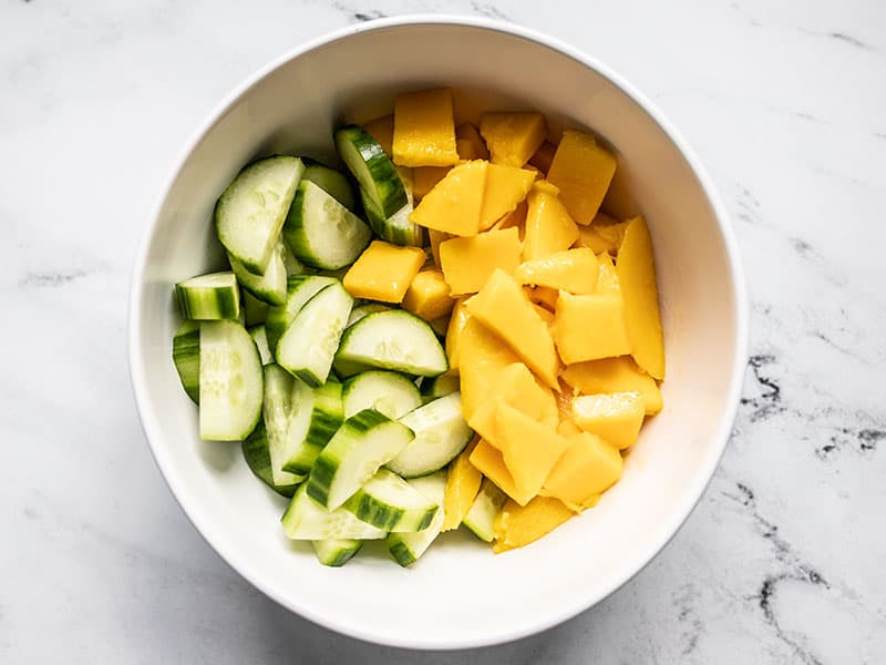 Cucumber and mango in a bowl
