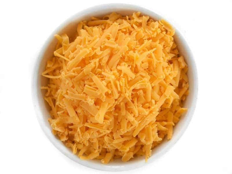 Top view of a bowl of Shredded Cheddar cheese 