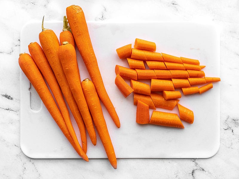 Peel and chopped carrots on a cutting board