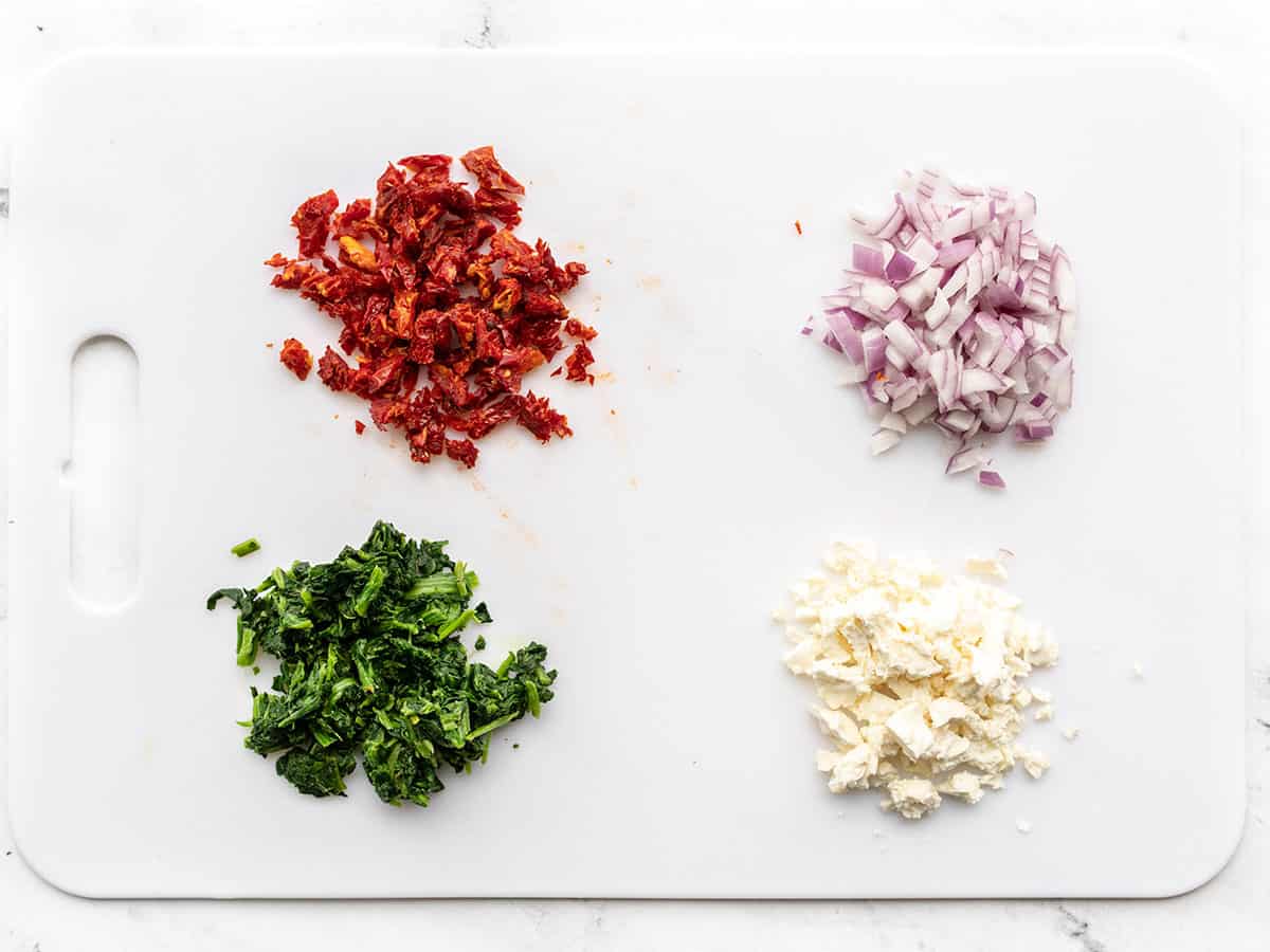 Chopped burger add-ins on a cutting board