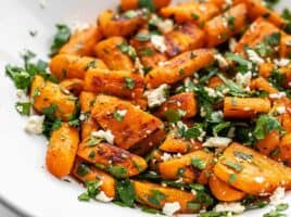Close up side view of roasted carrot and feta salad