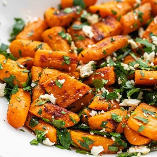Close up side view of roasted carrot and feta salad