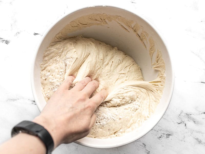Pull dough from sides of the bowl
