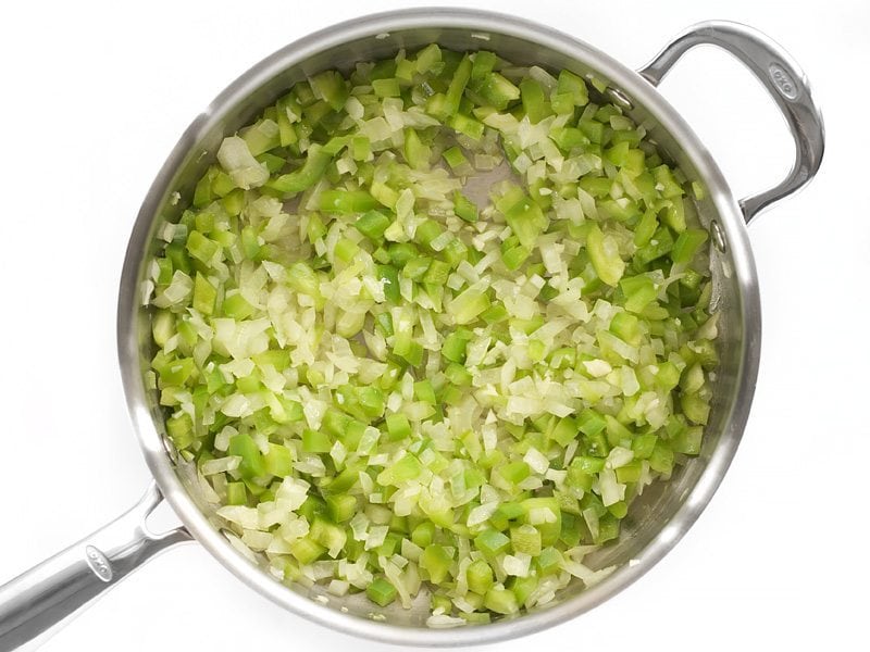 Green Bell Pepper diced and added to onions in skillet 