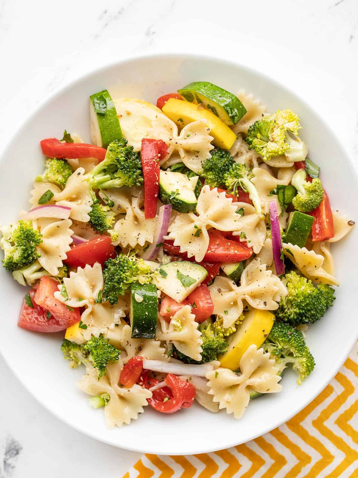 Overhead view of a bowl full of summer vegetable pasta salad