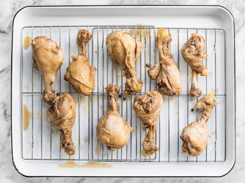 Chicken laid on pan ready to broil 