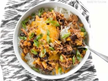 Slow Cooker Taco Chicken Bowls are the ultimate "set it and forget it" easy weeknight meal that the whole family will love. BudgetBytes.com