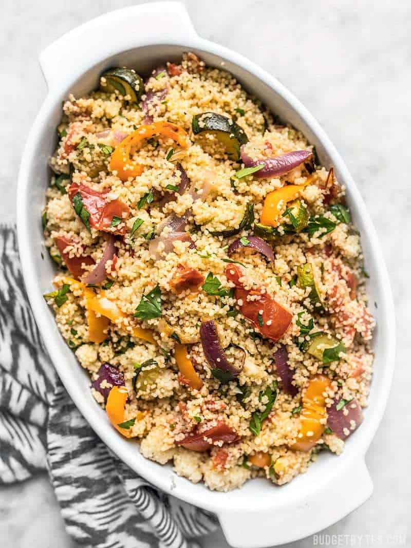 A casserole dish full of colorful Roasted Vegetable Couscous