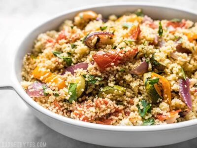 Roasted Vegetable Couscous is an easy side dish with complex flavor, with sweet roasted vegetables mixed with savory, fluffy couscous. Budgetbytes.com