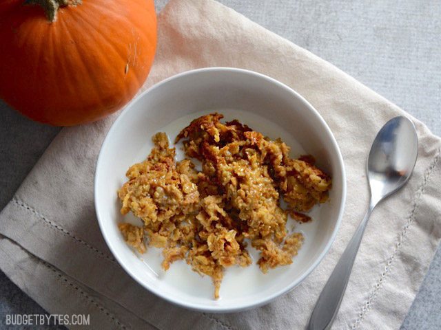 A bowl of Pumpkin Pie Baked Oatmeal with milk poured over top