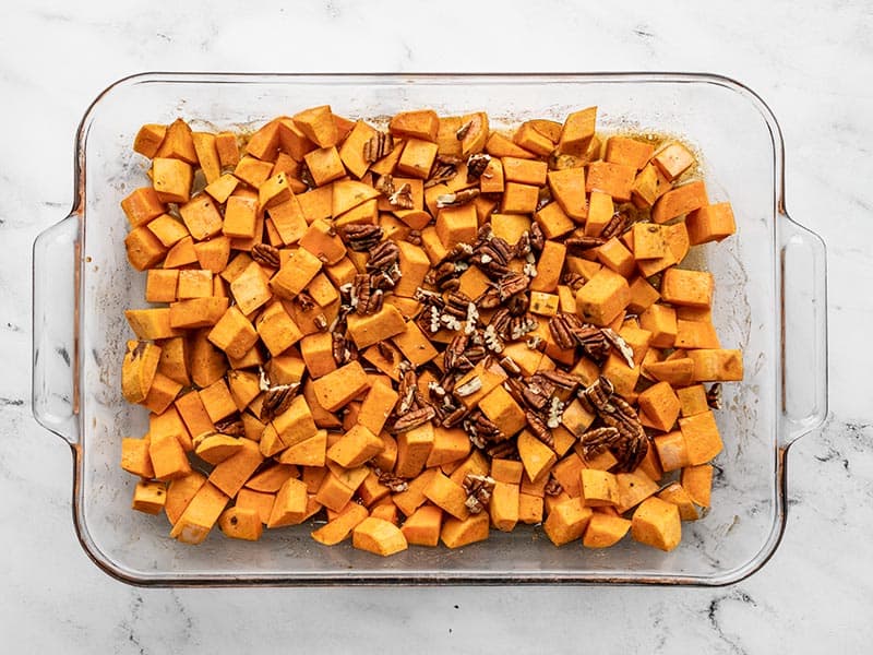 Pecans added to half roasted sweet potatoes