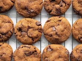 close up of chocolate molasses cookies on a cooling rack