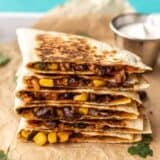 A stack of black bean quesadillas on a serving tray