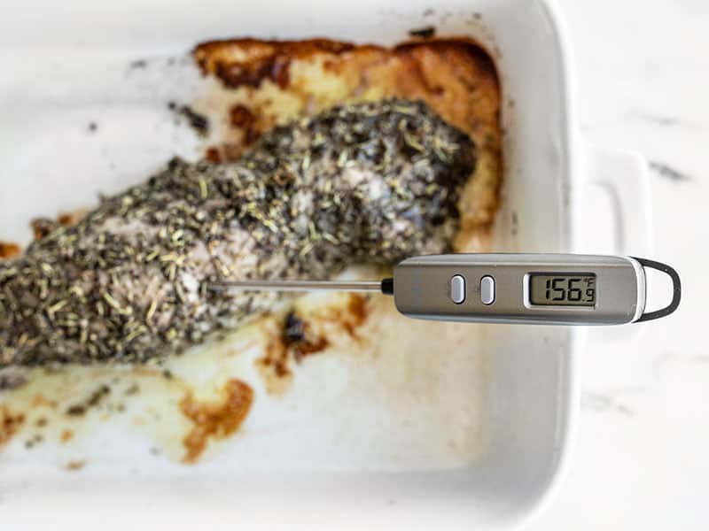 Meat thermometer in the roasted pork tenderloin