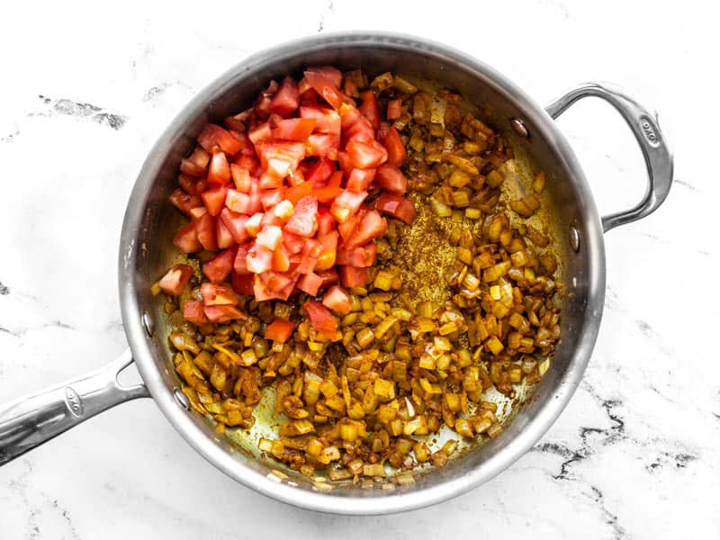 Diced tomato added to skillet