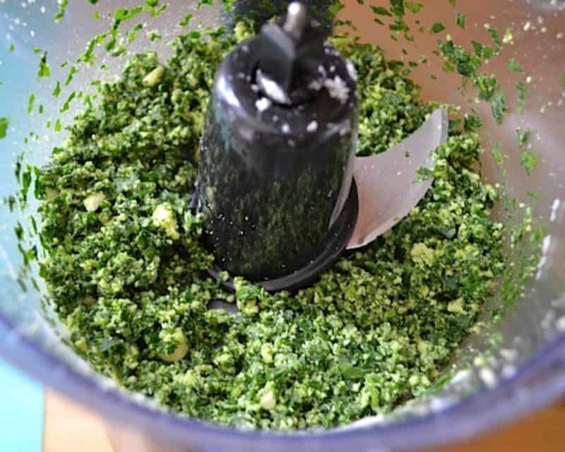 Pulsing the ingredients in a food processor.