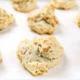 Front view of baked Rosemary Pepper Drop Biscuits on the baking sheet.