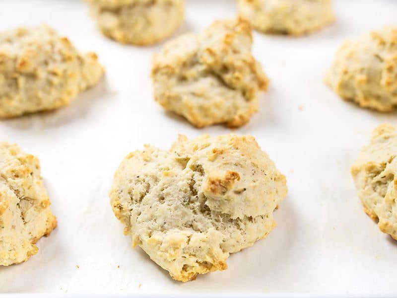 Front view of baked Rosemary Pepper Drop Biscuits on the baking sheet.