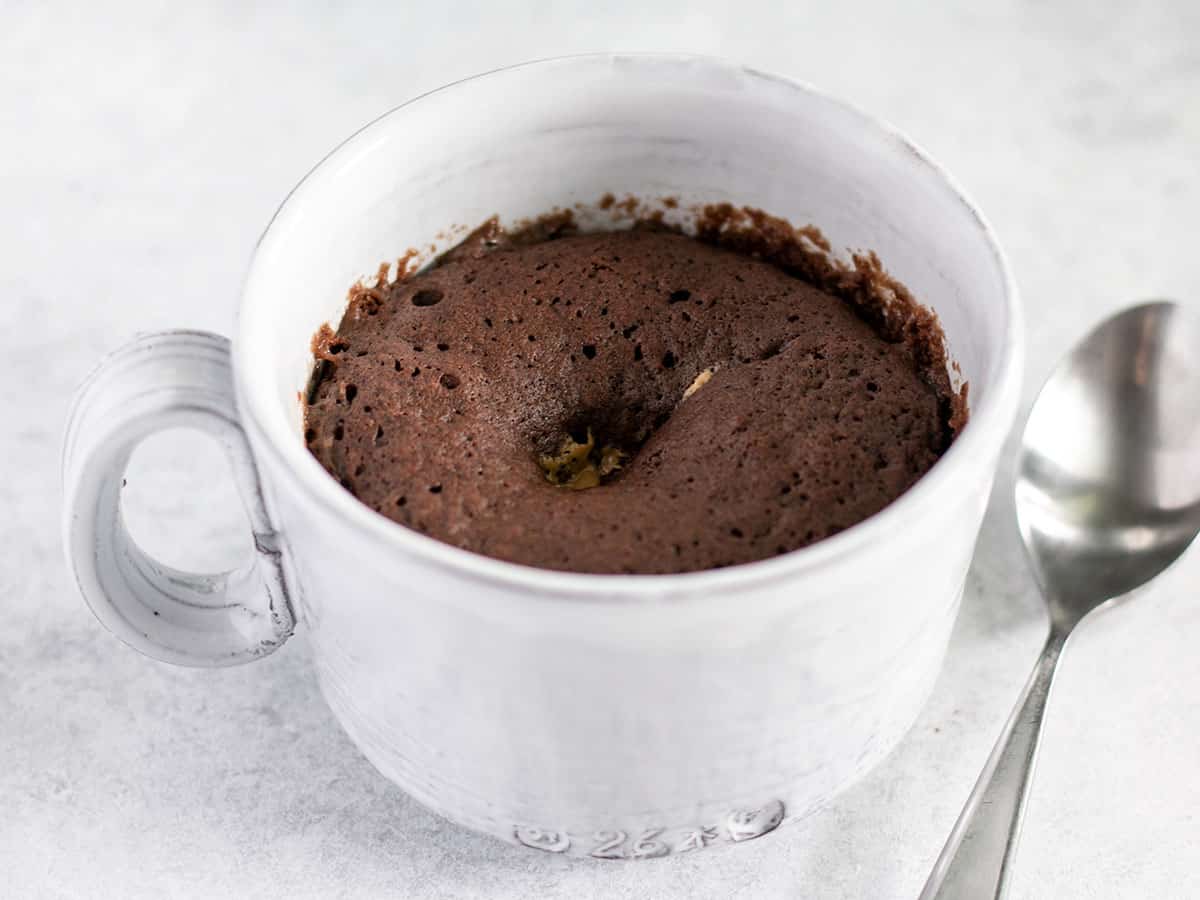 mug cake after microwaving, from the side.
