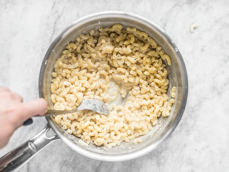 Macaroni simmered in milk in the sauce pot until tender