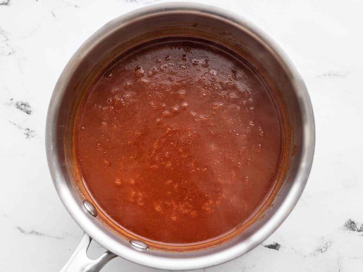 Simmered enchilada sauce in the sauce pot.