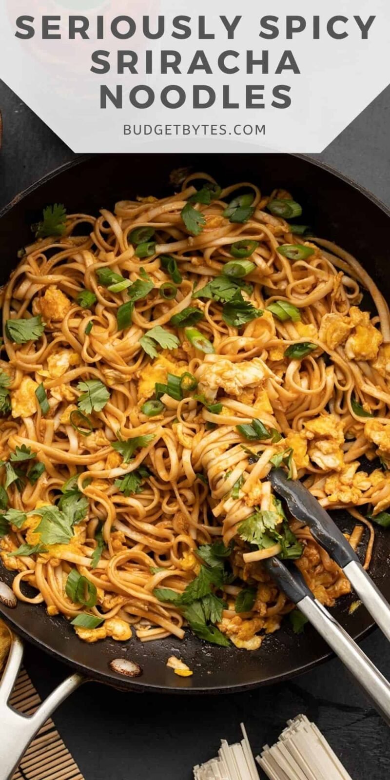 overhead view of spicy noodles in a skillet, title text at the top