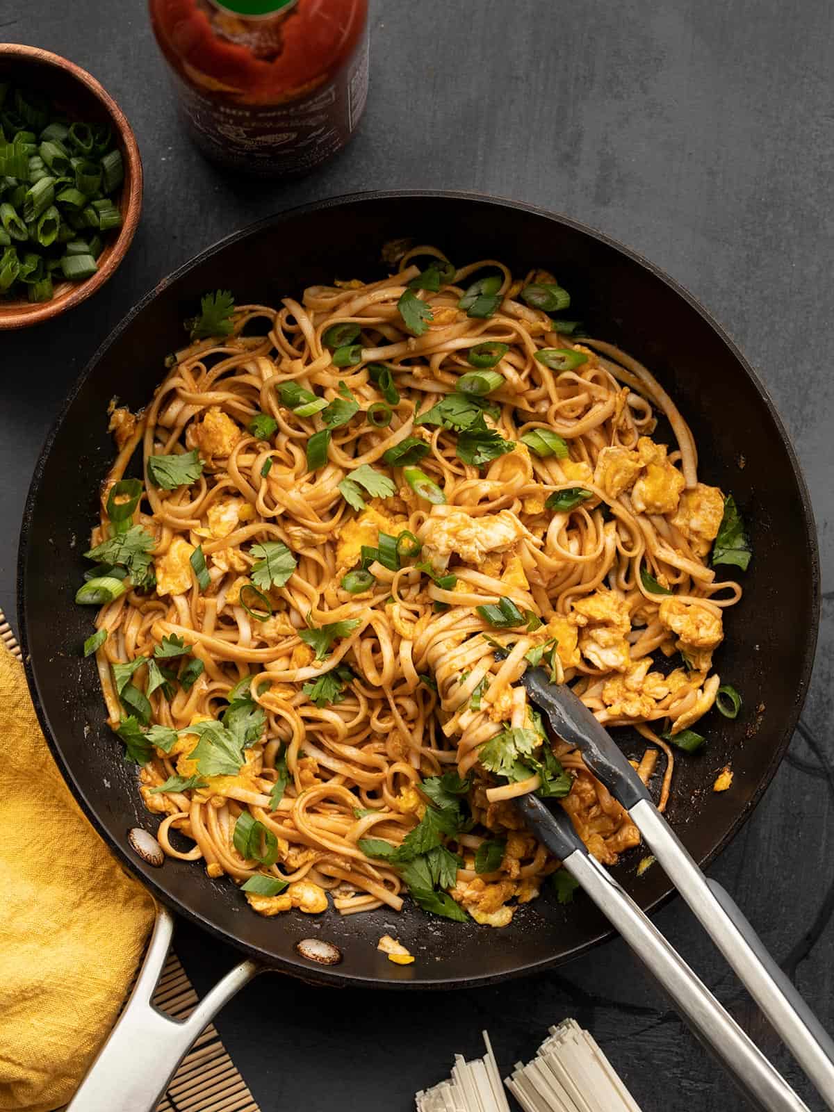 Overview of a skillet full of spicy noodles