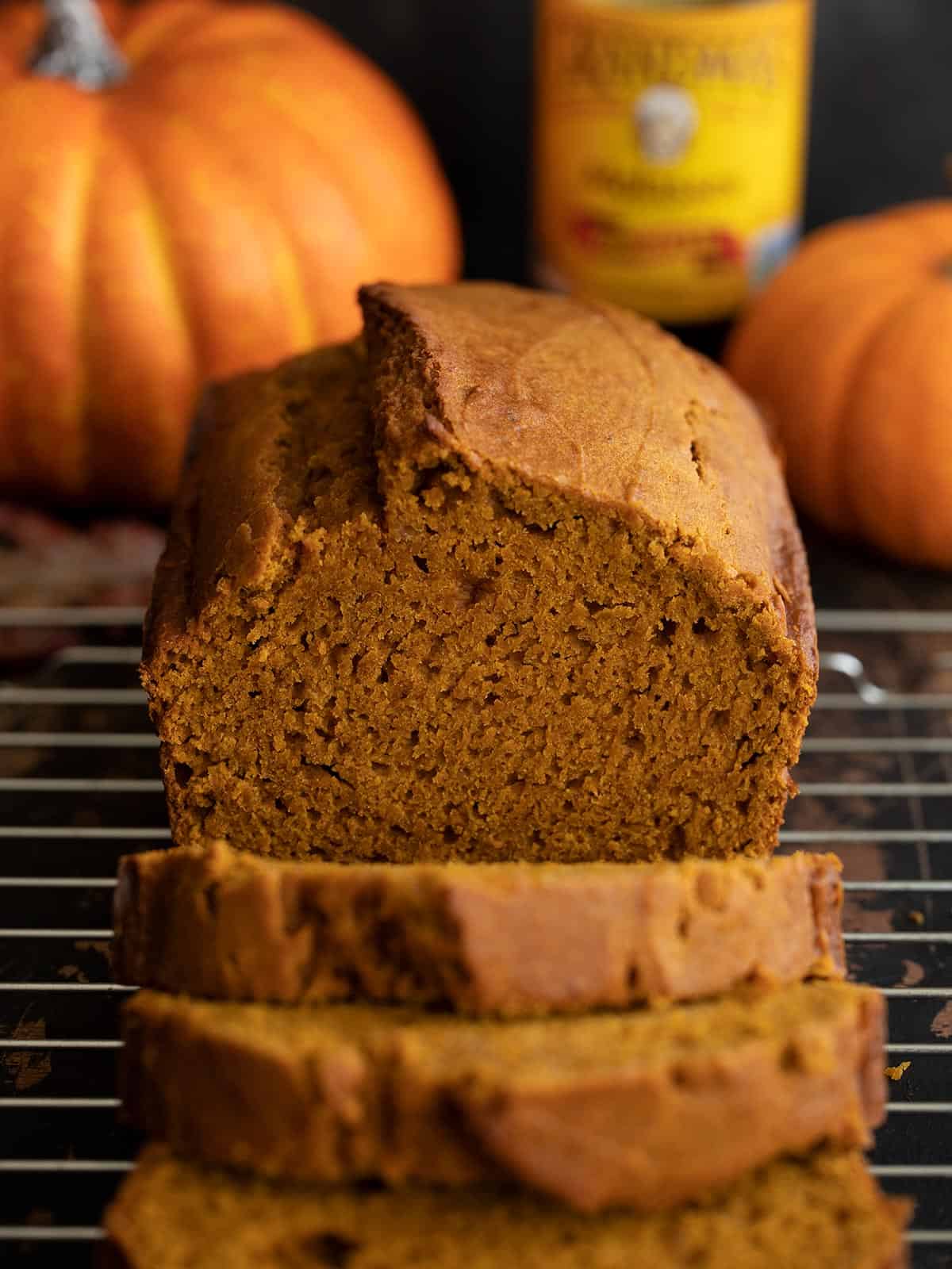 front view of a sliced loaf of pumpkin molasses bread