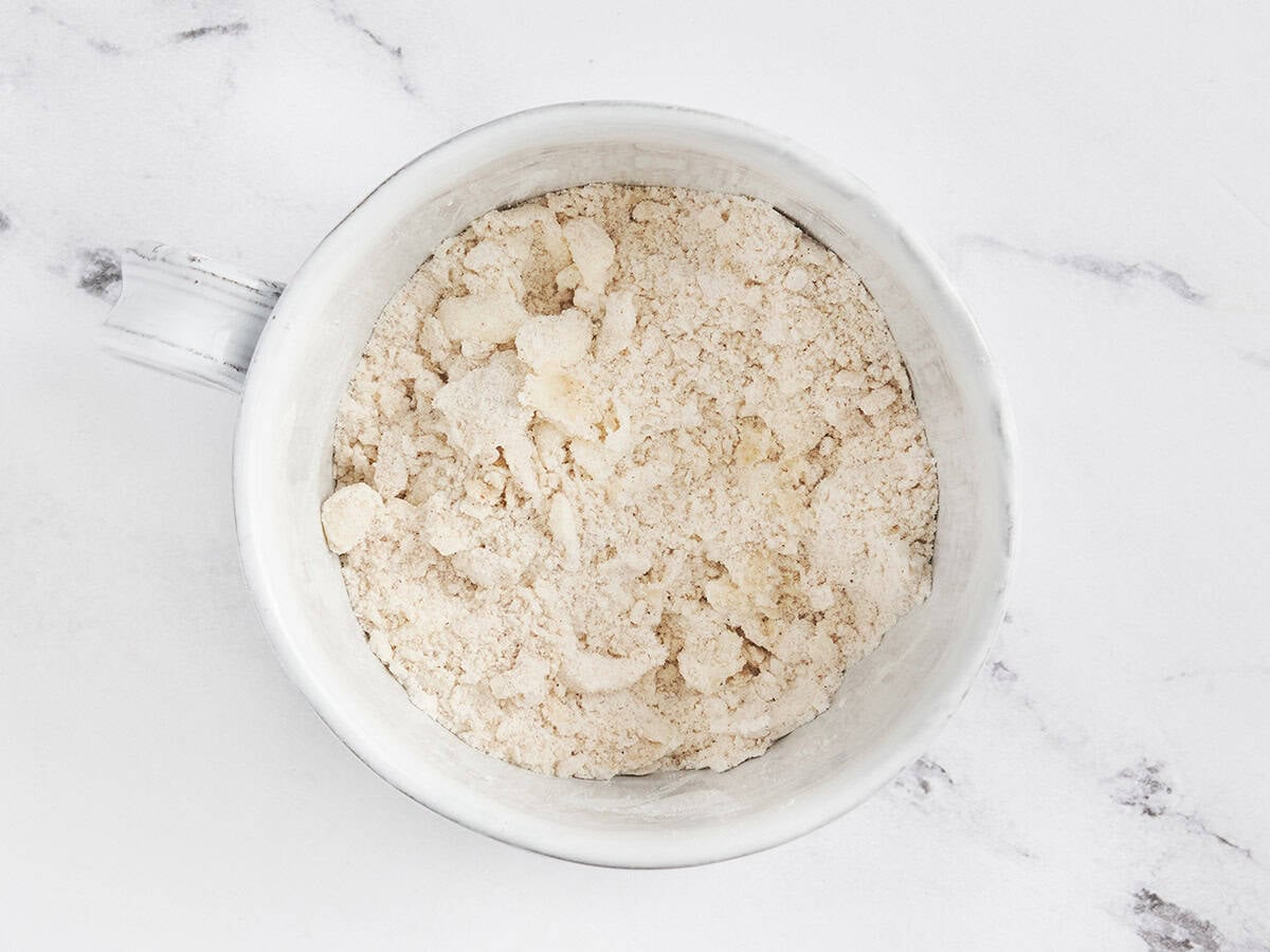milk added to other ingredients for blueberry mug muffin