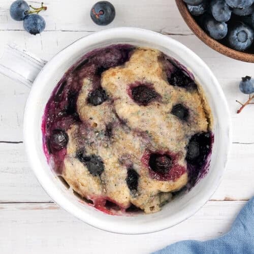 overhead view of blueberry mug muffin