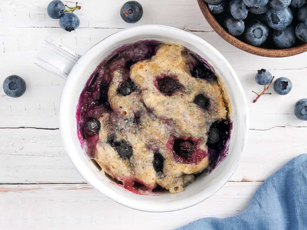overhead view of blueberry mug muffin