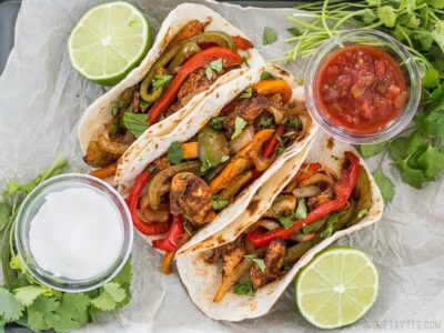 These Easy Oven Fajitas are a simple "set it and forget it" way to get that smoky sweet flavor of traditional griddle fajitas. BudgetBytes.com